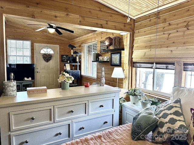 bedroom featuring lofted ceiling, wood ceiling, and wooden walls