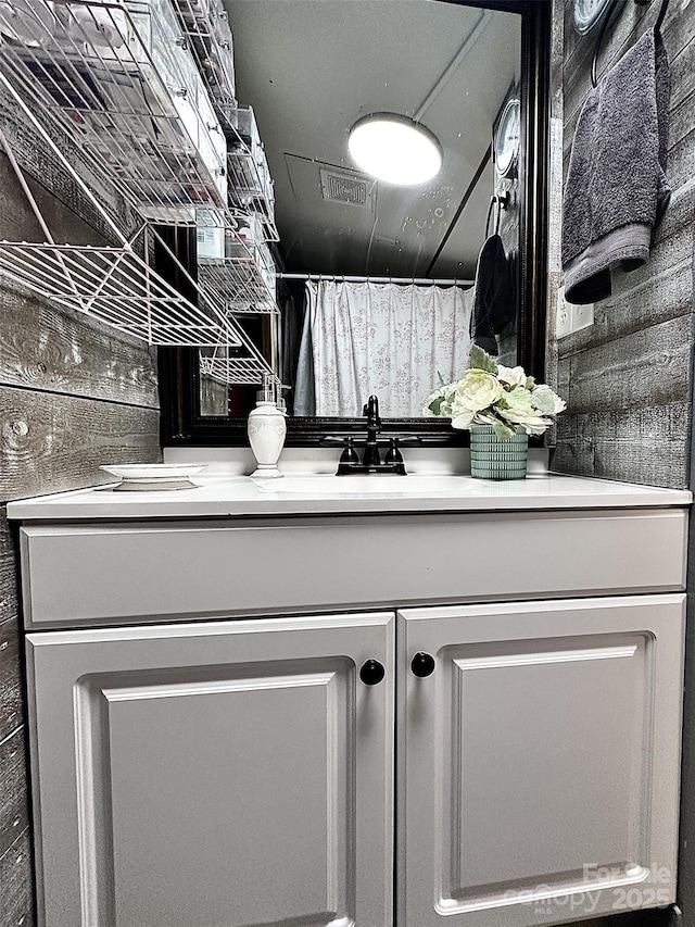 full bath with visible vents and vanity