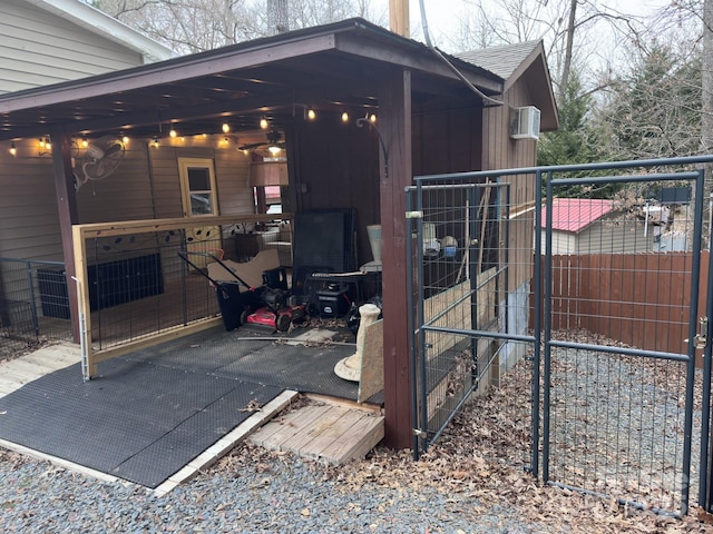 exterior space with fence and aphalt driveway