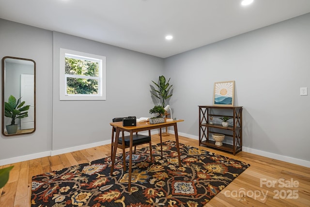 office featuring recessed lighting, baseboards, and wood finished floors