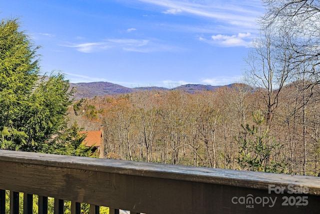 property view of mountains featuring a wooded view