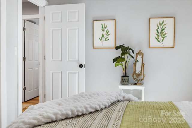 bedroom featuring wood finished floors