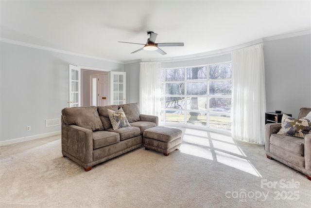 living room with ornamental molding, french doors, and visible vents