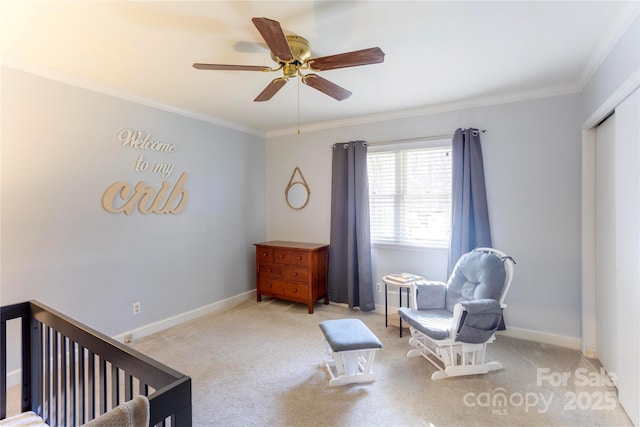 bedroom with light carpet, a ceiling fan, baseboards, and crown molding