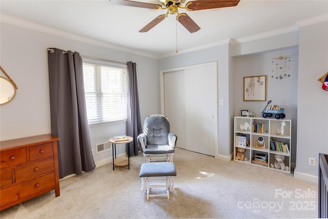 sitting room featuring light carpet, baseboards, visible vents, and crown molding