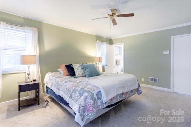 bedroom featuring baseboards, ornamental molding, visible vents, and light colored carpet