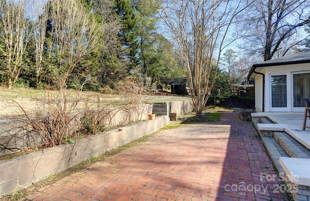 view of patio featuring fence