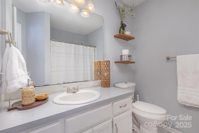 full bathroom with toilet, backsplash, and vanity