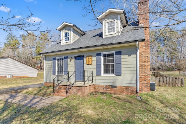 cape cod home featuring a chimney, roof with shingles, crawl space, cooling unit, and a front yard