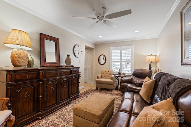 living area featuring baseboards, ornamental molding, a ceiling fan, and recessed lighting