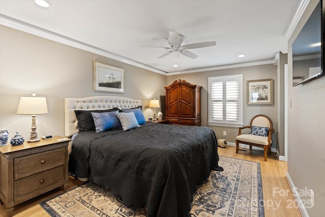 bedroom featuring light wood finished floors, recessed lighting, ornamental molding, a ceiling fan, and baseboards