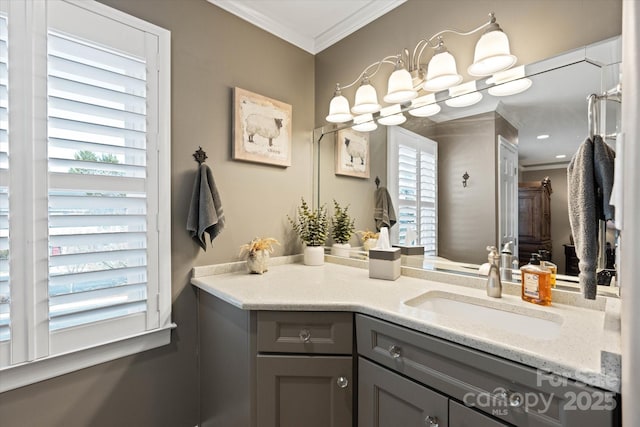 bathroom featuring ornamental molding and vanity