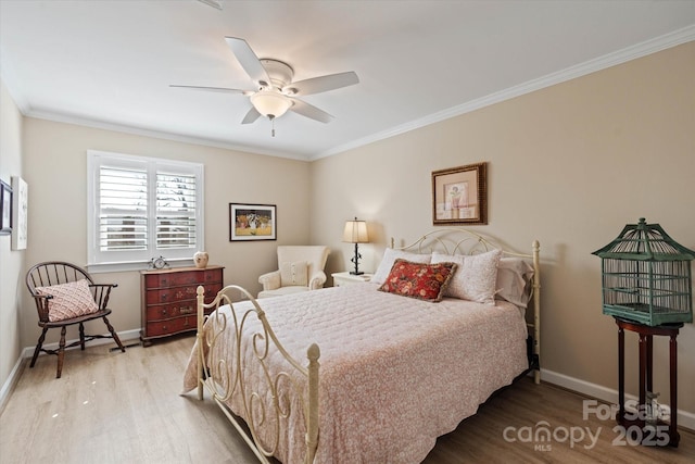 bedroom with baseboards, ornamental molding, and light wood-style floors