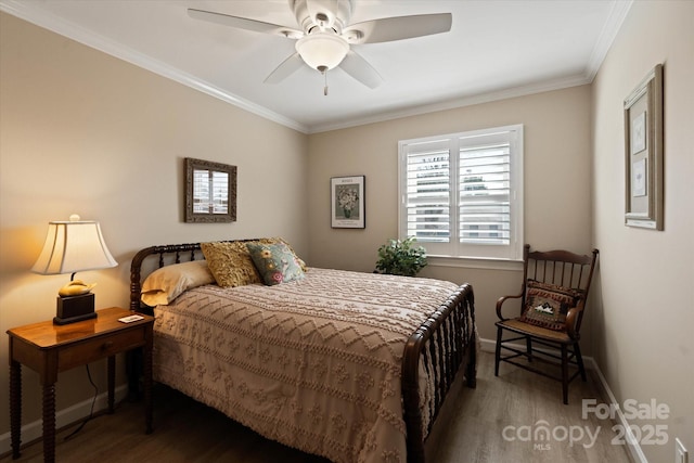 bedroom featuring ceiling fan, crown molding, baseboards, and wood finished floors