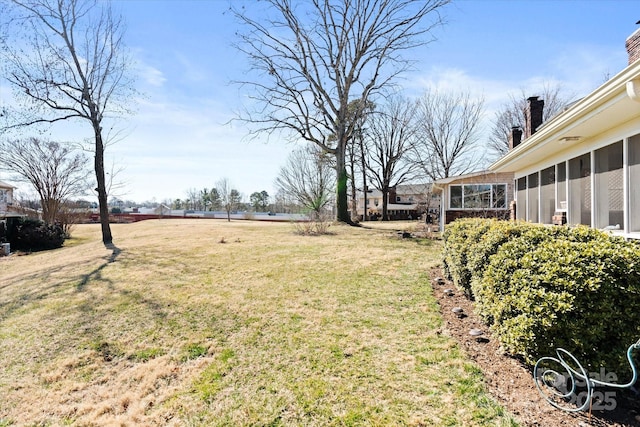 view of yard with a sunroom