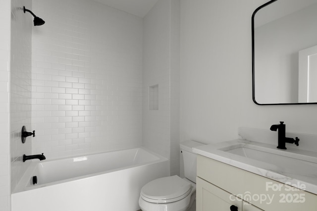 bathroom featuring shower / bathing tub combination, vanity, and toilet