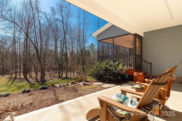 view of patio / terrace featuring a sunroom