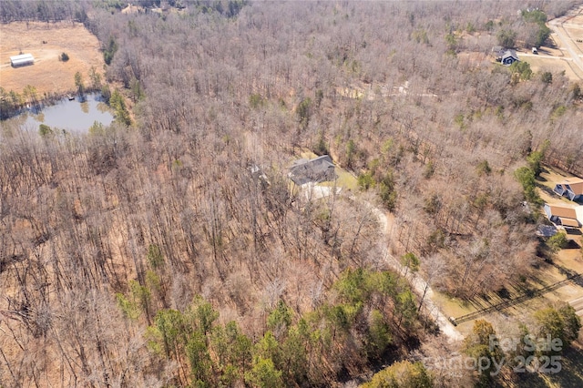 aerial view with a water view and a view of trees