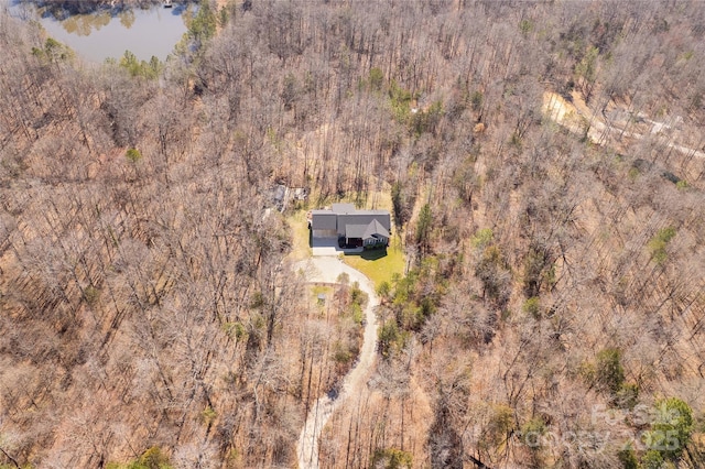 bird's eye view with a water view and a view of trees