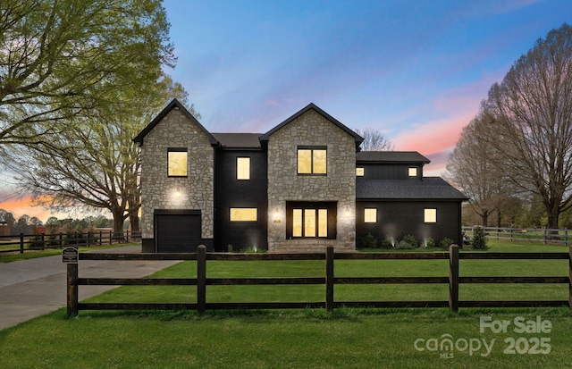 1575 Shinnville Rd, Cleveland, NC 27013 - traditional-style house featuring a fenced front yard, driveway, stone siding, a front yard, and an attached garage