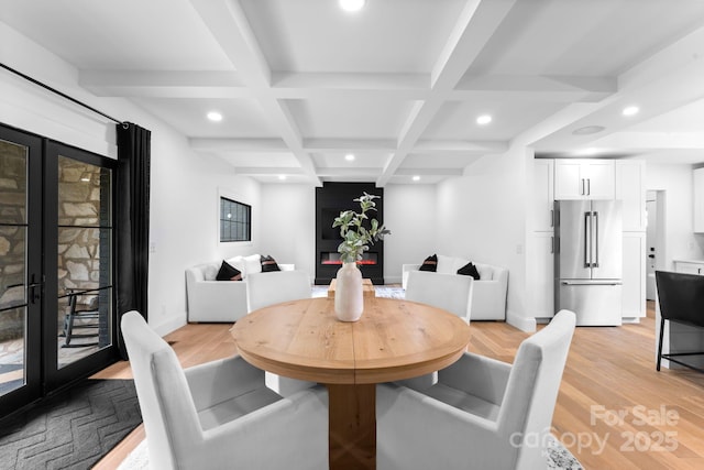 dining space with light wood-type flooring, coffered ceiling, beam ceiling, and recessed lighting