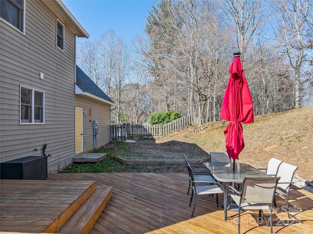 wooden terrace with fence and outdoor dining space