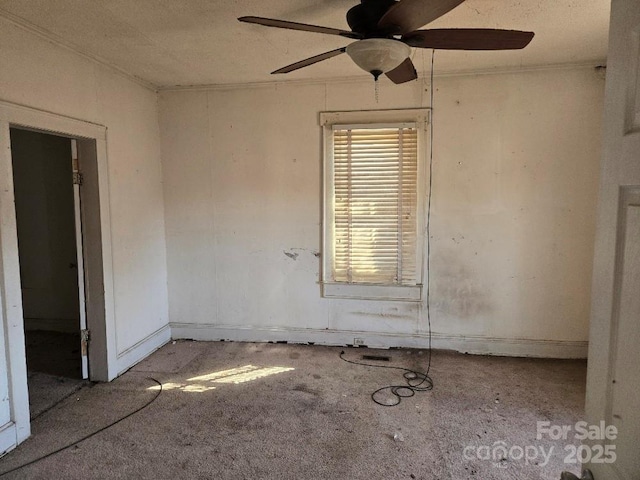 unfurnished room with a ceiling fan