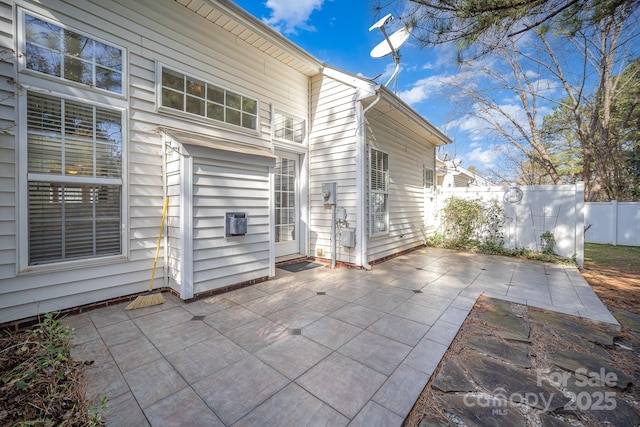 view of patio featuring fence