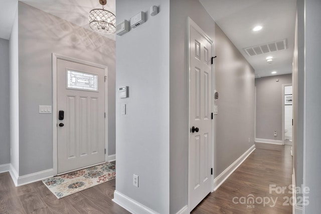 foyer entrance with recessed lighting, wood finished floors, visible vents, and baseboards