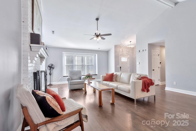 living area with dark wood-style floors, a brick fireplace, visible vents, and baseboards