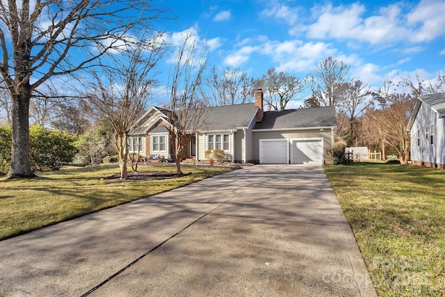 ranch-style home featuring a garage, a chimney, concrete driveway, and a front yard