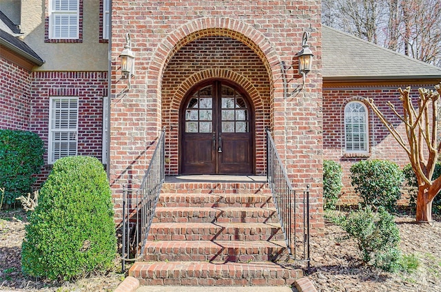 6548 Robin Hollow Dr, Mint Hill, NC 28227 - doorway to property featuring french doors, brick siding, and roof with shingles
