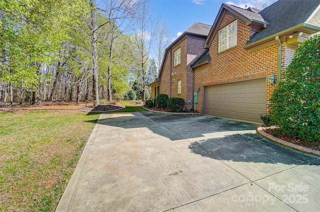 6548 Robin Hollow Dr, Mint Hill, NC 28227 - view of home's exterior featuring an attached garage, a lawn, brick siding, and driveway