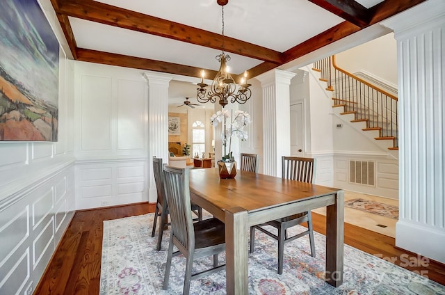 6548 Robin Hollow Dr, Mint Hill, NC 28227 - dining space featuring a decorative wall, visible vents, an inviting chandelier, and ornate columns
