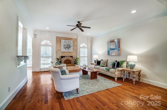 6548 Robin Hollow Dr, Mint Hill, NC 28227 - living room with crown molding, wood finished floors, and a healthy amount of sunlight