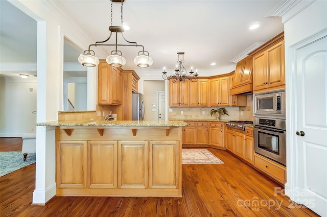 6548 Robin Hollow Dr, Mint Hill, NC 28227 - kitchen with a peninsula, ornamental molding, light stone countertops, and stainless steel appliances
