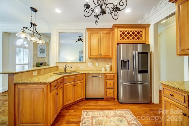 6548 Robin Hollow Dr, Mint Hill, NC 28227 - kitchen featuring a sink, stainless steel appliances, light wood-style floors, and crown molding