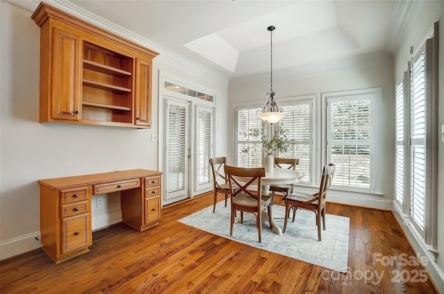 6548 Robin Hollow Dr, Mint Hill, NC 28227 - dining area featuring a raised ceiling, wood finished floors, and baseboards