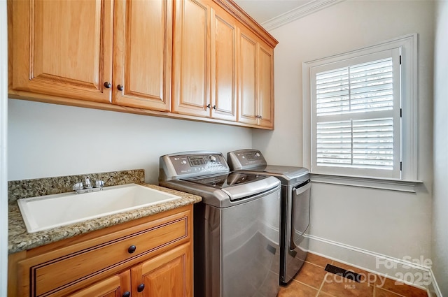 6548 Robin Hollow Dr, Mint Hill, NC 28227 - clothes washing area with tile patterned flooring, washing machine and dryer, ornamental molding, cabinet space, and a sink