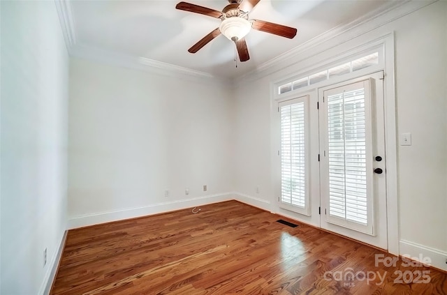 6548 Robin Hollow Dr, Mint Hill, NC 28227 - spare room with visible vents, wood finished floors, baseboards, and ornamental molding