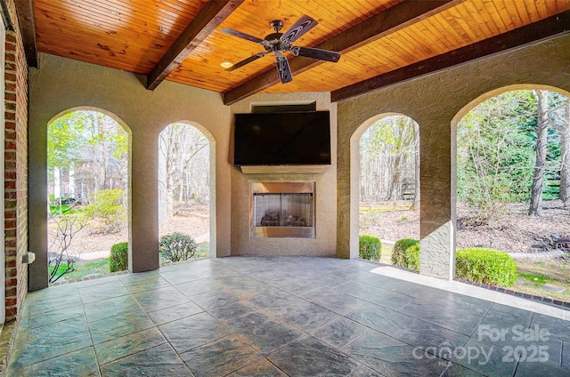 6548 Robin Hollow Dr, Mint Hill, NC 28227 - view of patio / terrace with ceiling fan and an outdoor fireplace