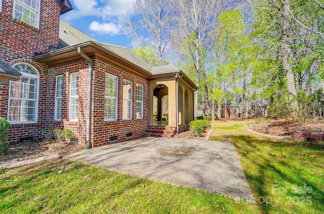 6548 Robin Hollow Dr, Mint Hill, NC 28227 - view of side of home with brick siding, a yard, and a patio