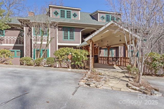61 Creekside Way Unit G201, Burnsville, NC 28714 - view of front of property with a shingled roof and a chimney