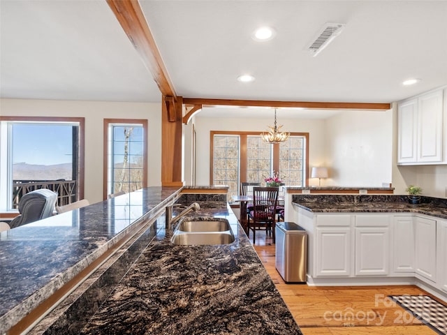 61 Creekside Way Unit G201, Burnsville, NC 28714 - kitchen with a sink, a chandelier, white cabinetry, recessed lighting, and light wood-style floors