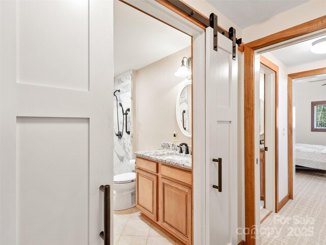 61 Creekside Way Unit G201, Burnsville, NC 28714 - ensuite bathroom featuring vanity, a shower, toilet, and tile patterned flooring