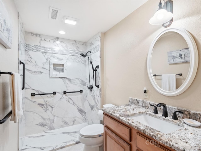 61 Creekside Way Unit G201, Burnsville, NC 28714 - bathroom featuring a marble finish shower, vanity, and toilet