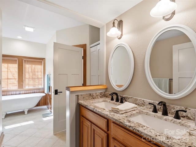 61 Creekside Way Unit G201, Burnsville, NC 28714 - bathroom featuring double vanity, a freestanding bath, and tile patterned flooring