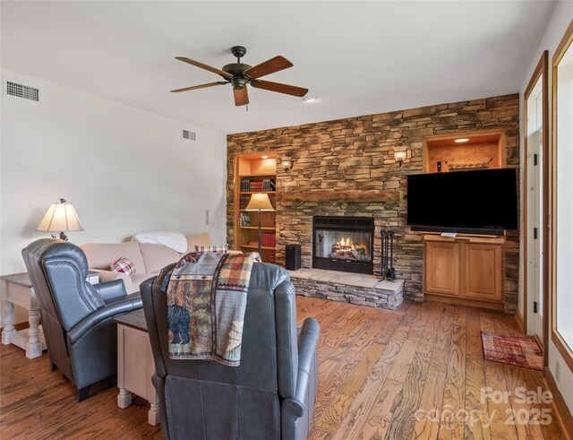 61 Creekside Way Unit G201, Burnsville, NC 28714 - living area with ceiling fan, wood finished floors, and a fireplace