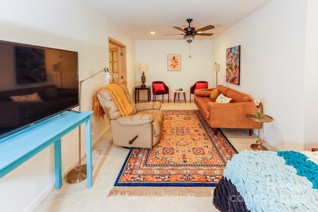 living area with recessed lighting, baseboards, a ceiling fan, and tile patterned floors