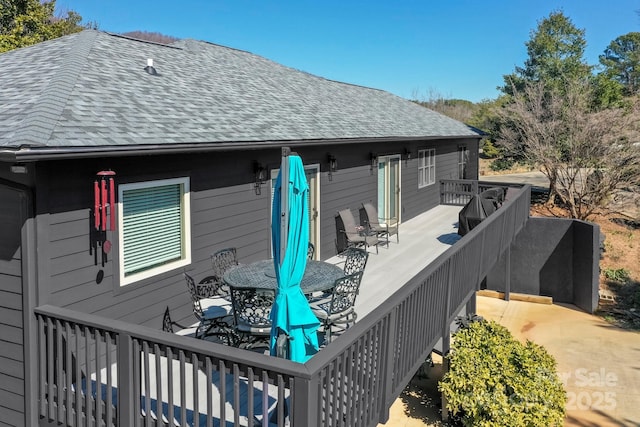 deck featuring outdoor dining area